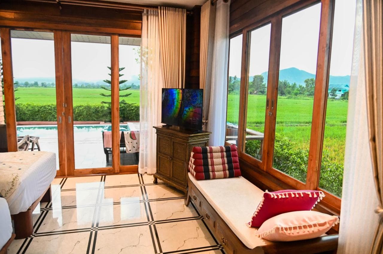 Mountain View Room at Doona Resort with timber windows overlooking rice fields and mountains